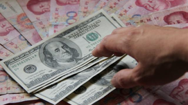 人民币高估才危险：中国经济下行压力或将加大